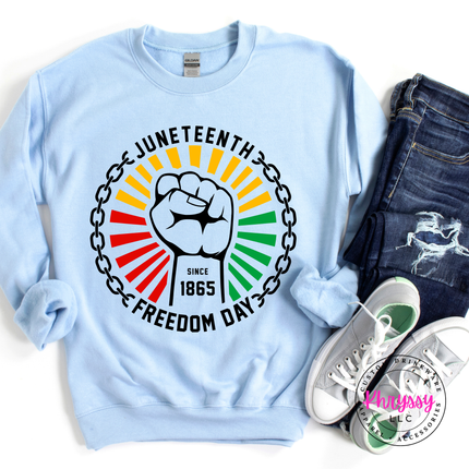 Light Blue crewneck sweatshirt showing a black raised-fist Pan-African Juneteenth graphic.