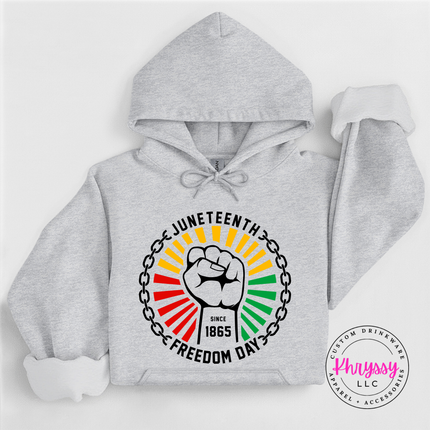 Ash pullover hoodie with a black Juneteenth raised-fist Freedom Day graphic.