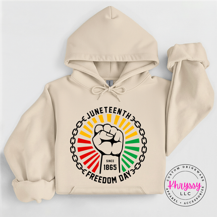 Sand pullover hoodie displaying a black raised-fist Juneteenth 1865 graphic.