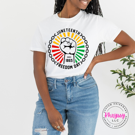 White garment-dyed tee displaying a black raised-fist Juneteenth 1865 graphic.