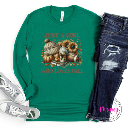Kelly long sleeve tee with the autumn pumpkins and football fall graphic