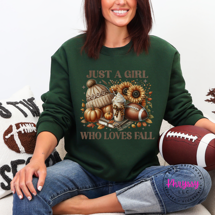 Woman wearing a forest green crewneck sweatshirt with a fall icon collage.