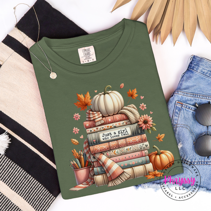 Woman wearing a Hemp tee with the autumn book lover pumpkin stack print