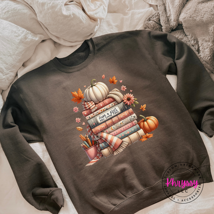 Dark Chocolate crewneck sweatshirt featuring an illustrated stack of books.