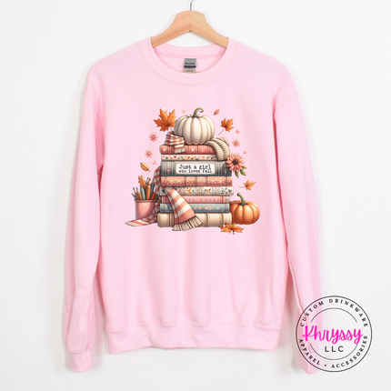 Light Pink crewneck sweatshirt featuring a cozy stack of books graphic.