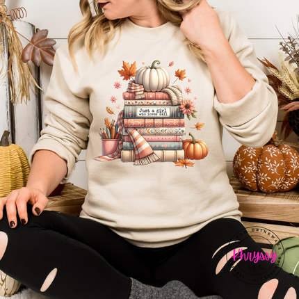 Sand colored crewneck sweatshirt with a hand-illustrated book stack design.