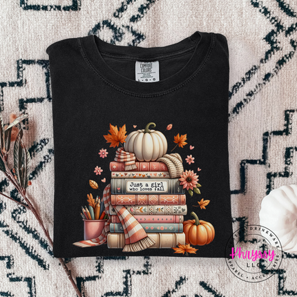 Black tee with the girl who loves fall book stack graphic