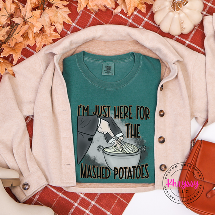 Blue Spruce graphic tee featuring a witch and whisk illustration.