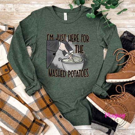 Heather Green tee styled for fall, featuring a mashed potatoes witch design.