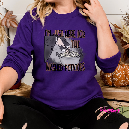 Purple crewneck sweatshirt with a hand-illustrated witch print.