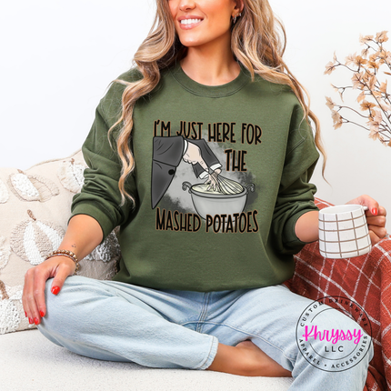 Military Green colored crewneck sweatshirt featuring a mashed potatoes witch design.