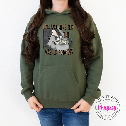 Military green crewneck sweatshirt with a hand-illustrated witch print.