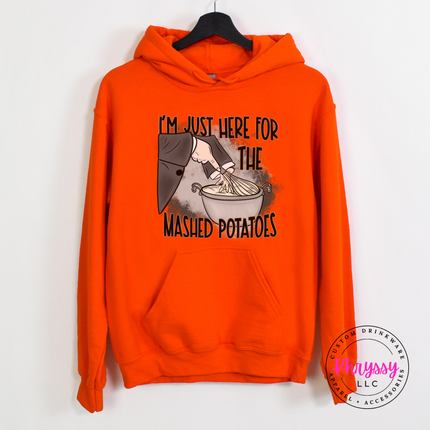 Orange hoodie with the Thanksgiving mashed potatoes quote graphic
