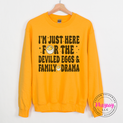 Gold crewneck sweatshirt with the retro deviled eggs and family drama lettering