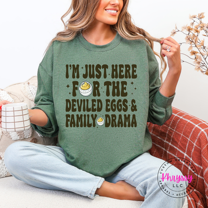 Heather sport dark green crewneck sweatshirt styled for fall with a deviled eggs graphic.