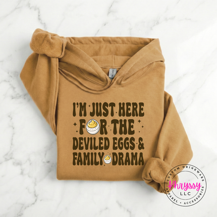 Old gold heavyweight hoodie styled for fall with a deviled eggs graphic.