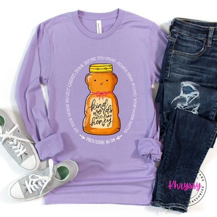 Purple long-sleeve shirt with honey bear graphic and text, paired with jeans and sneakers on a white background.