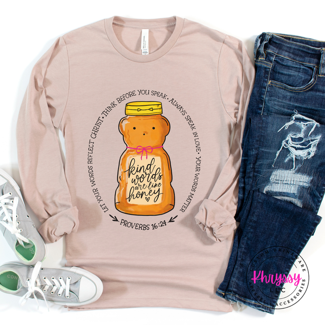 Pink long-sleeve shirt with honey bear graphic and text, paired with jeans and sneakers on a white background.