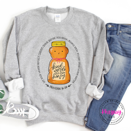 Gray sweatshirt with a honey bear graphic and text, paired with jeans and sneakers on a white background.