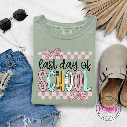 Bay blue garment-dyed tee featuring coquette bows and playful lettering.