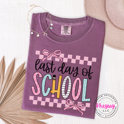 Berry comfort colors tee with a pastel last day of school bow print.