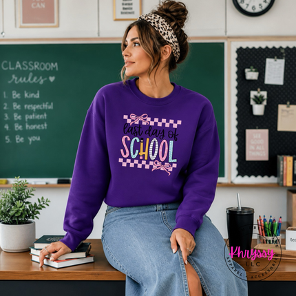 Purple cozy crewneck styled with a pretty last day of school graphic.