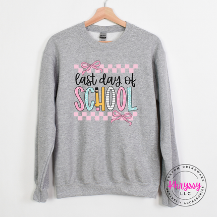 Sport grey crewneck showing pastel pinks and bows on a school design.