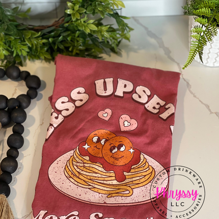 KhryssyLLC 'Less Upsetti More Spaghetti' T-shirt: Features a fun, cartoon design of spaghetti and meatballs with heart details. Perfect for food lovers.