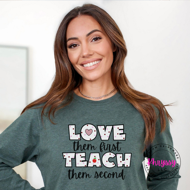Cheerful teacher heart long sleeve on Heather Forest Bella Canvas with black polka dot lettering and red apple graphic