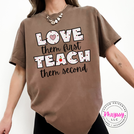 Warm cheerful teacher heart statement on Espresso Comfort Colors tee with black polka dot lettering and red apple