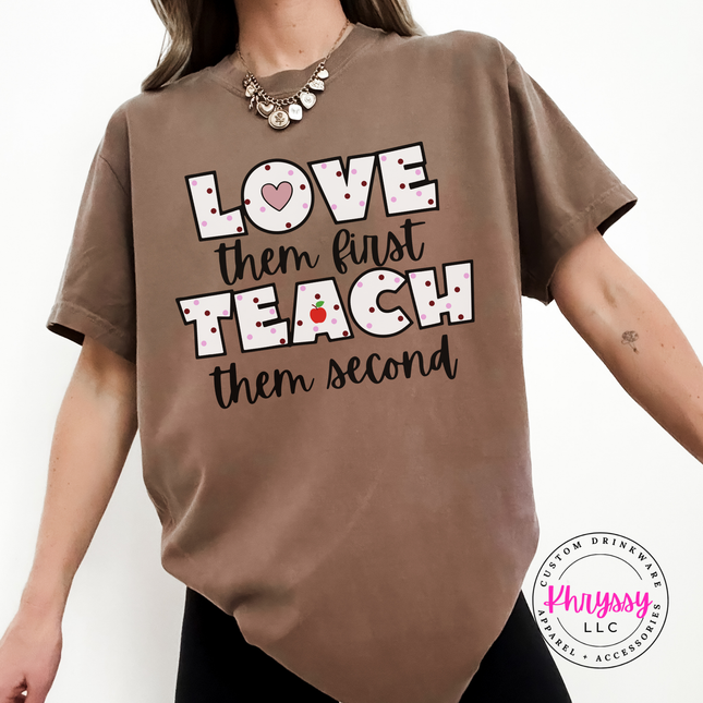 Warm cheerful teacher heart statement on Espresso Comfort Colors tee with black polka dot lettering and red apple