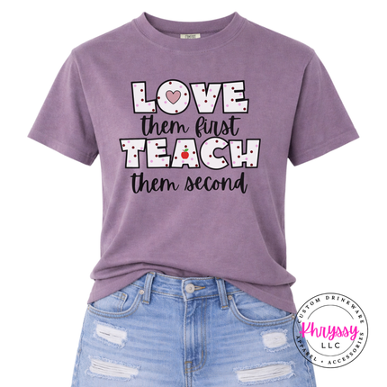 Soft blue Wine Comfort Colors tee featuring love them first teach them second polka dot teacher heart statement