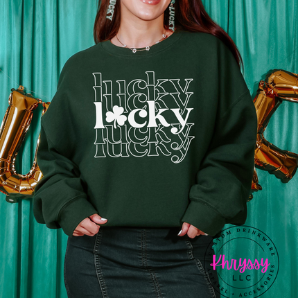 Woman modeling a cozy Lucky Sweatshirt with a green backdrop and festive decorations.
