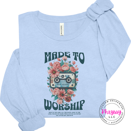 Light blue long sleeve tee featuring teal worship lettering and coral blooms