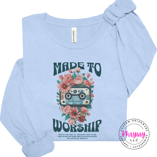 Light blue long sleeve tee featuring teal worship lettering and coral blooms