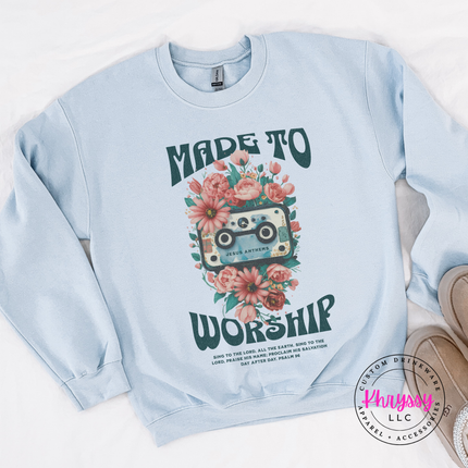 Light blue crewneck sweatshirt with a vintage cassette faith graphic