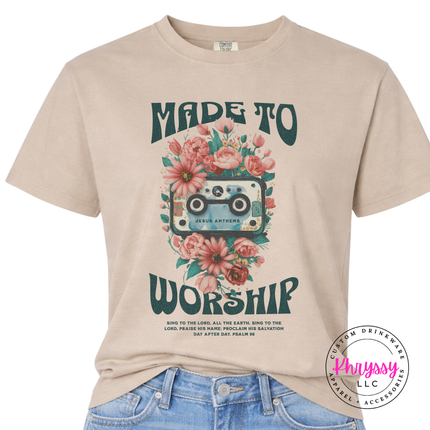 Khaki tee with teal worship lettering and a blooming cassette illustration