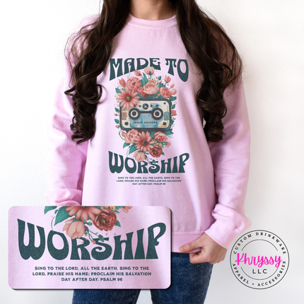Person wearing a pink sweatshirt with 'Made to Worship' design, holding a matching mouse pad.