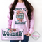 Person wearing a pink sweatshirt with 'Made to Worship' design, holding a matching mouse pad.