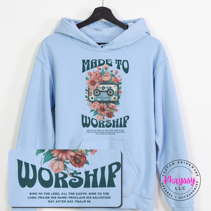 light blue hoodie featuring teal worship lettering wrapped in coral blooms