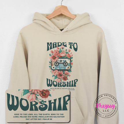 Sand hoodie showing the Made To Worship cassette and flower illustration