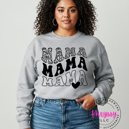 Woman wearing a gray sweatshirt with 'MAMA MAMA MAMA' text design on a plain background