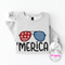 Ash crewneck sweatshirt with a retro patriotic sunglasses and Merica graphic.