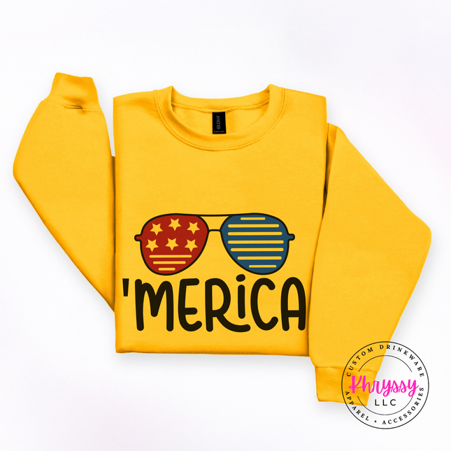 Gold crewneck sweatshirt featuring red and blue shades with bold black lettering.