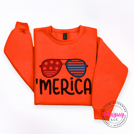 Orange crewneck sweatshirt with a playful Merica patriotic sunglasses print.