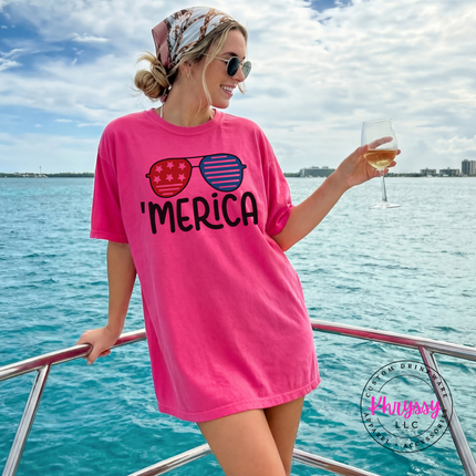 Heliconia garment-dyed tee featuring red and blue sunglasses with bold black lettering.