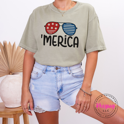 Sandstone garment-dyed tee with a playful Merica patriotic sunglasses print.