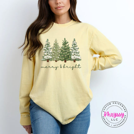 Close up of Christmas trees on a Butter Comfort Colors long sleeve tee.
