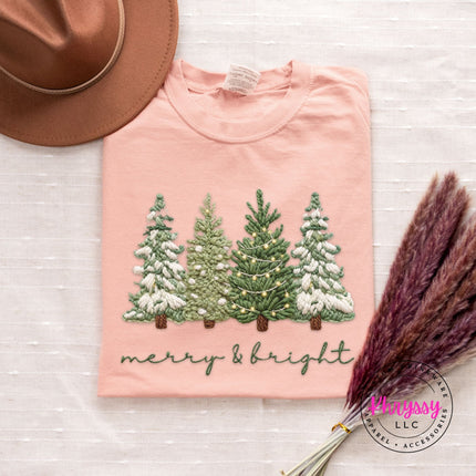 Terracotta long sleeve tee with a classic snowy Christmas trees graphic, flat lay view.