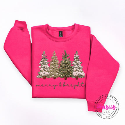 Heliconia heavyweight crewneck sweatshirt with snowy evergreen trees and soft script lettering.